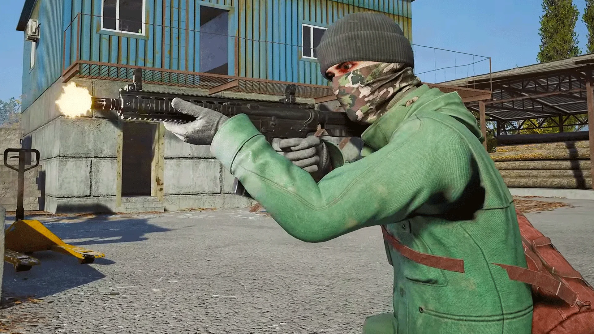 Deadside combat still from IGN of a masked player firing beside a blue warehouse